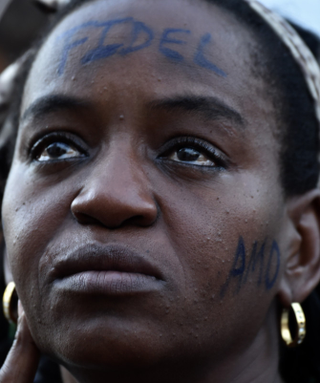 Cubans cry while waiting for the arrival of the convoy carrying the remains of Cuban revolutionary leader Fidel Castro in Cienfuegos, 240 km southeast from Havana, on December 1, 2016. A military jeep is taking the ashes of Fidel Castro on a four-day journey across Cuba, with islanders lining the roads to bid farewell to the late communist icon. Castro died at 90 on November 25, 2016 and will be buried in the eastern city of Santiago de Cuba on Sunday. /